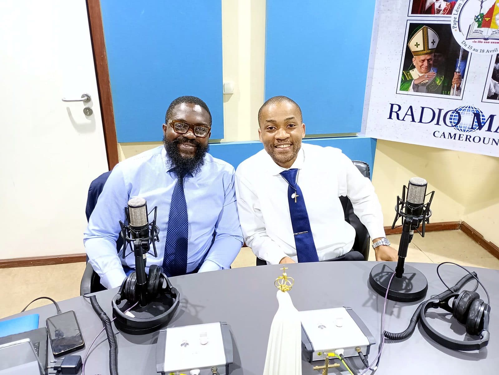 Two guests seated at the Radio Maria Cameroon studio table